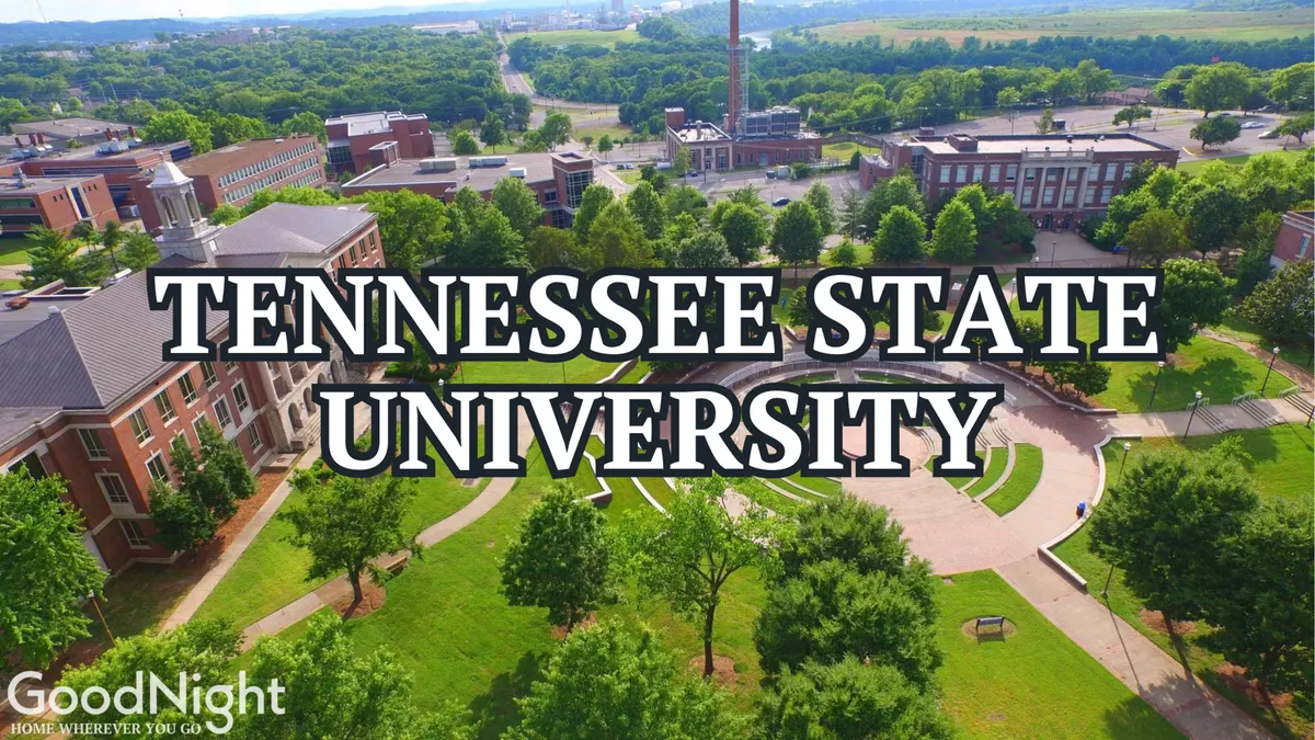 A sweeping view of Vanderbilt University's main buildings framed by lush green lawns, walkways, and mature trees. The scene captures students and visitors moving between classes and relaxing outdoors, conveying the vibrancy and accessibility of Midtown's academic hub.